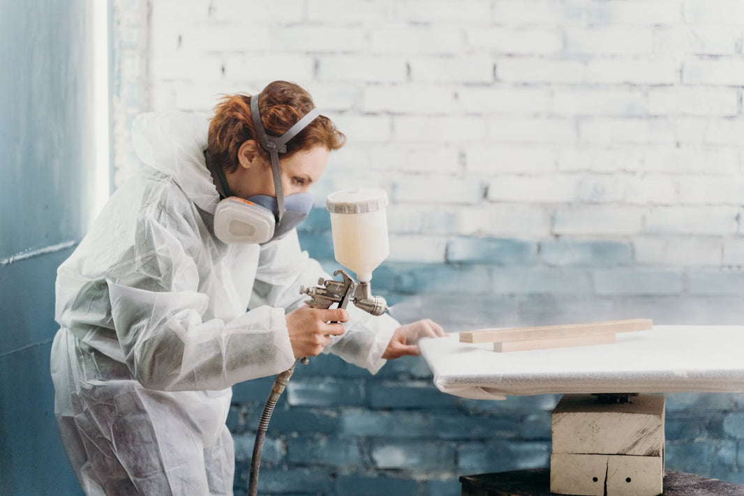 person using a paint sprayer