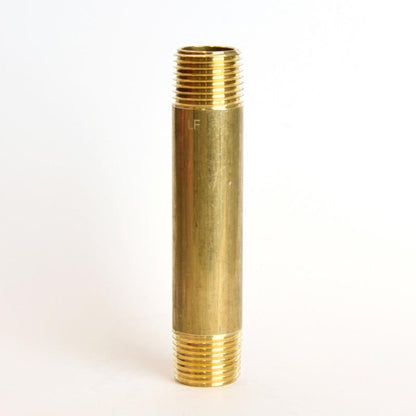 Set of five brass nipples, 1/2" x 4" MPT, used in plumbing, shown in a close-up image highlighting their threaded ends.