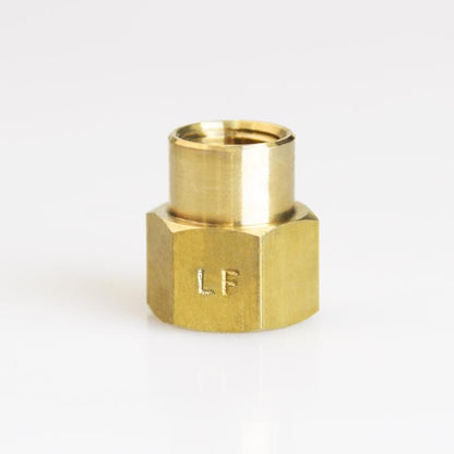 Pack of five brass 3/8-inch by 1/4-inch FPT pipe fittings, bulk Emery Jensen brass plumbing couplings on white background.