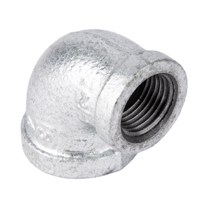 Set of five galvanized 90-degree elbow fittings, 3/4 inch by 1/2 inch, with red markings, used for plumbing connections.