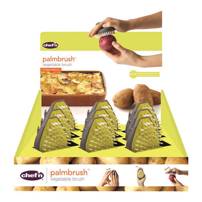 Emery Jensen vegetable brush set with nine yellow and green handheld brushes for cleaning produce.