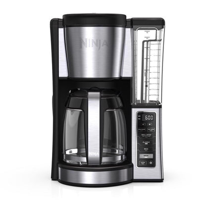Emery Jensen COFE MKR PRGRM Black 12-Cup Auto Drip Coffee Maker on kitchen counter with glass carafe and control panel.