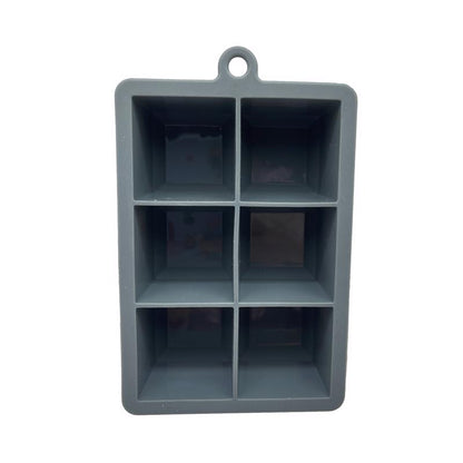 Silicone ice cube tray by Emery Jensen for barware, with large ice cubes in a clear silicone mold.