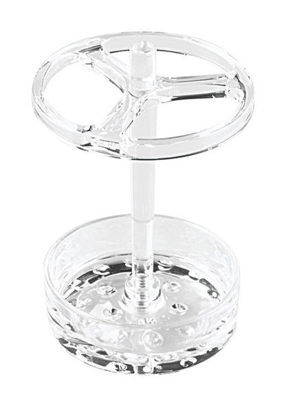 Clear Emery Jensen toothbrush holder for bathroom accessories, designed to hold toothbrushes securely in a modern bathroom setting.