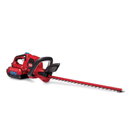 Emery Jensen 60V 24-inch battery hedge trimmers with dual blades for trimming and shaping hedges and shrubs outdoors.