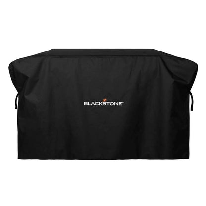 Black Emery Jensen 28-inch BBQ grill griddle cover protecting a flat-top griddle from outdoor elements.