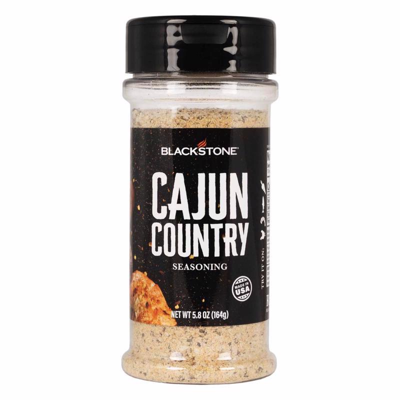 Emery Jensen BBQ seasoning jar labeled "BBQ SNG CJUN CNTRY" 5.8oz, with a close-up view of the spice blend container.