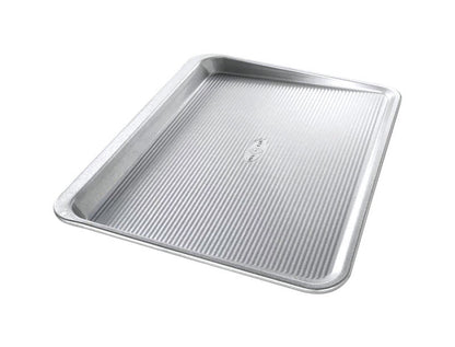 Large Emery Jensen cookie sheet, 18x14 inches, made of durable tin bakeware, ideal for baking cookies and pastries.