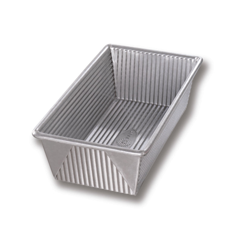 Emery Jensen Best Tin Bakeware loaf pan measuring 8.5x4.5 inches, with a non-stick surface and sturdy metal construction.