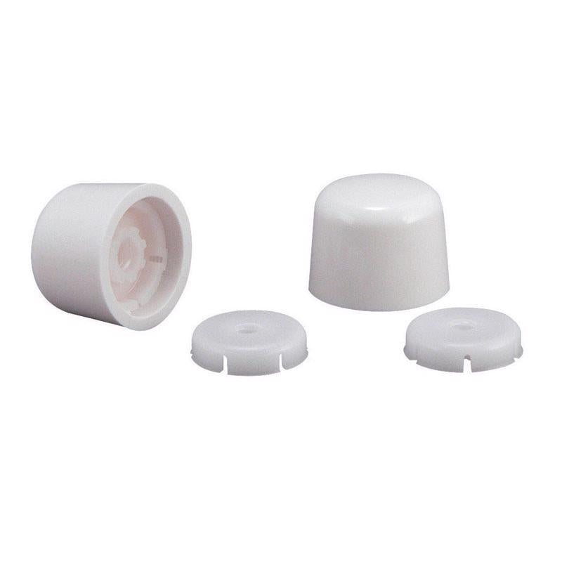 White toilet bolt caps by Emery Jensen, close-up of the plastic caps covering toilet bolts and gaskets.