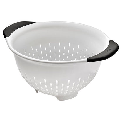 White 3-quart plastic colander by Emery Jensen, with large drainage holes and sturdy handle for rinsing and draining foods.