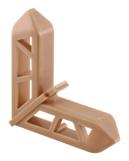 Emery Jensen bulk backroom corner trim, 3/4 inch bronze Pella style, shown in a warehouse setting.