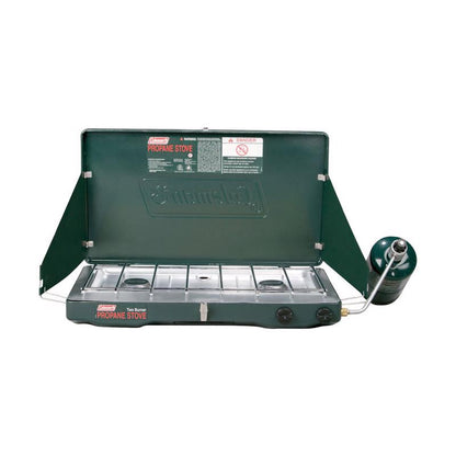 Emery Jensen Coleman propane camp stove STV 2BUR with two burners and stainless steel surface for outdoor cooking.