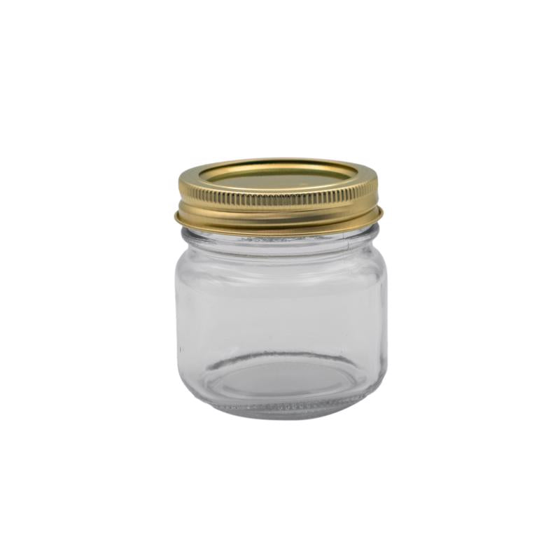 Set of 12 Emery Jensen 8oz canning jars with metal lids, ideal for preserving and storing homemade jams and preserves.