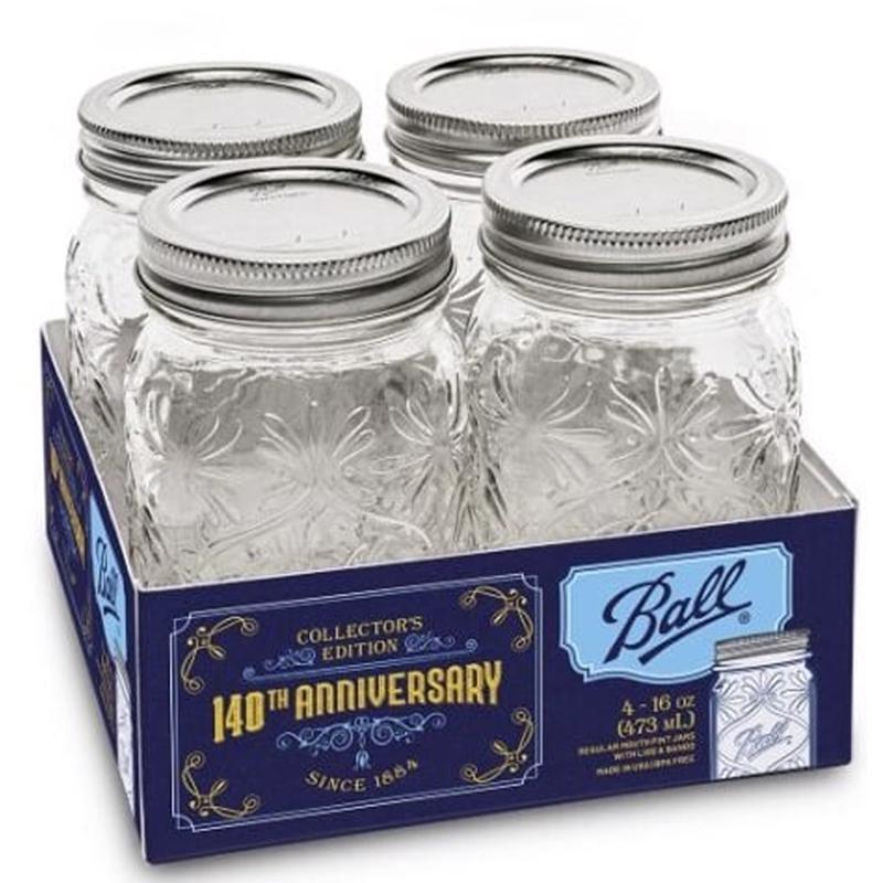 Set of four Emery Jensen Canning Jars from the COMMEMORTV ROM 4PK, clear glass jars for preserving and storage.
