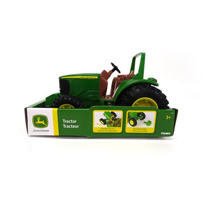 Green JD tractor toy by Emery Jensen, a plastic farm vehicle suitable for children, featured in a detailed product image.