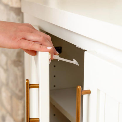 Set of 12 plastic child safety cabinet locks by Emery Jensen, designed to secure cabinets and prevent access by children.