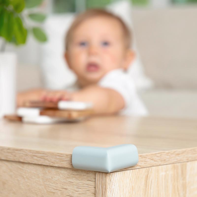 Emery Jensen corner cushions Rubr 4-pack for child safety, soft foam protectors on furniture corners in a home setting