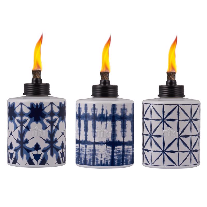 Set of six Emery Jensen citronella torches in blue and white, 5.75 inches tall, ideal for outdoor lighting and pest control.