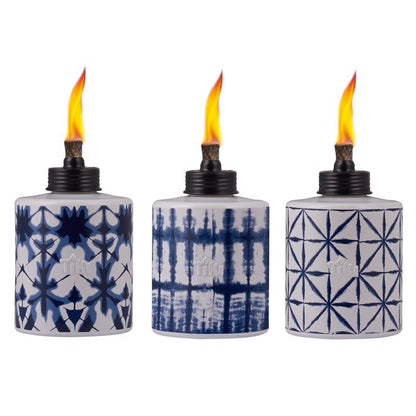 Set of six Emery Jensen citronella torches in blue and white, 5.75 inches tall, ideal for outdoor lighting and pest control.