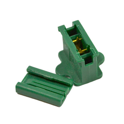 Green ZIP inline plug from Emery Jensen commercial lighting, showing a close-up of the electrical connector with a textured grip.