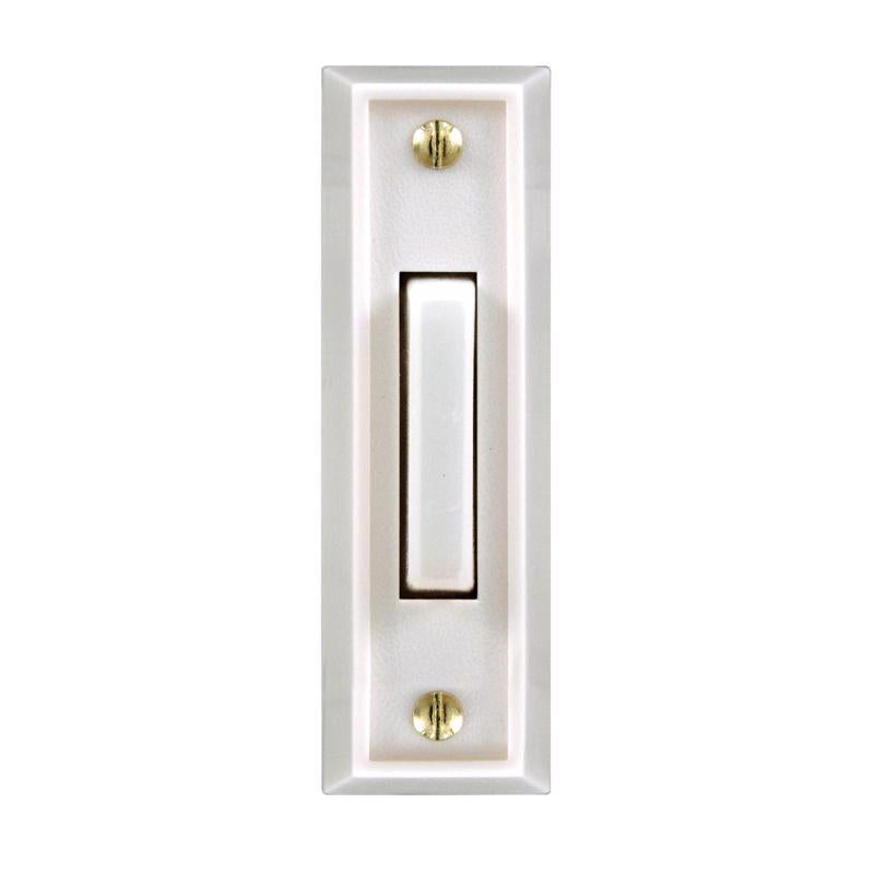 White wired door button from Emery Jensen, with lit indicator for doorbell or access control, shown in a close-up image.