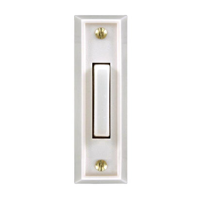 White wired door button from Emery Jensen, with lit indicator for doorbell or access control, shown in a close-up image.