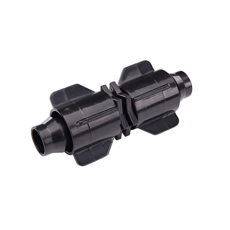 Emery Jensen Stretch N Lock coupling for drip irrigation, black plastic connector with locking mechanism, used in garden irrigation systems.