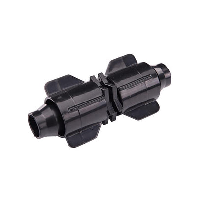 Emery Jensen Stretch N Lock coupling for drip irrigation, black plastic connector with locking mechanism, used in garden irrigation systems.