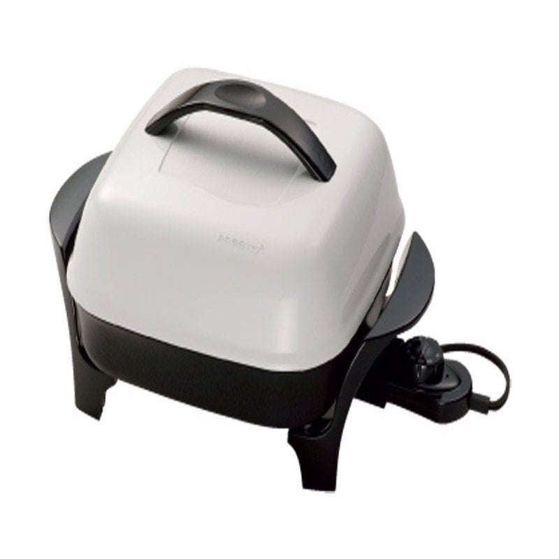 Electric skillet by Emery Jensen, 11-inch Presto model, featuring a non-stick surface and adjustable temperature control.