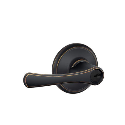 Emery Jensen Avila entry lever in antique brass finish, showcasing a sleek door handle with a modern design.