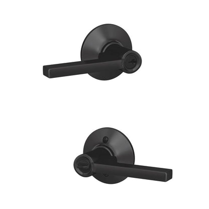 Emery Jensen Latitude entry lever door handle in matte black mounted on a door, showcasing its sleek design and sturdy construction.