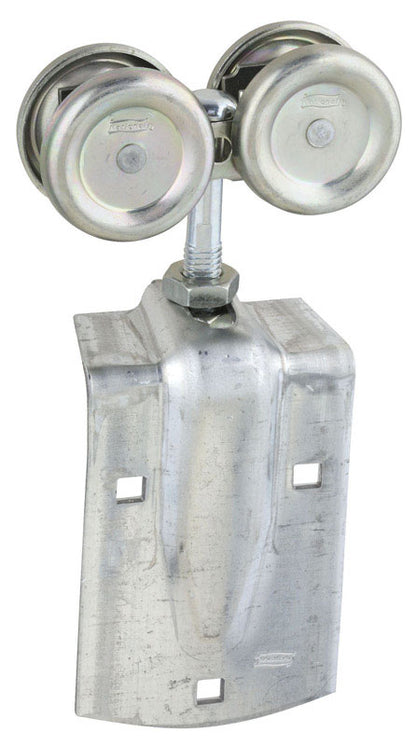 Emery Jensen exterior barn door hardware with zinc box rail hanger mounted on a rustic wooden barn door.