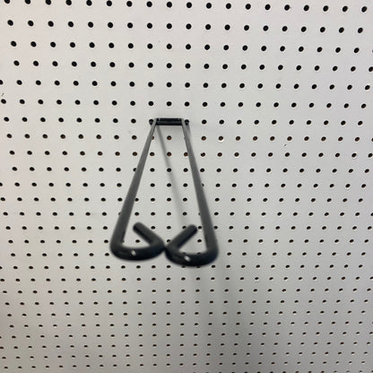 Emery Jensen 18-inch broom loop hook fixture for organizing and hanging cleaning tools on walls.
