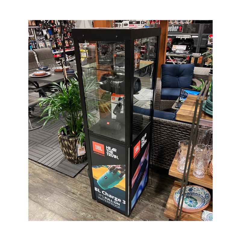 Black fixture with a display speaker from Emery Jensen, designed for secure mounting in commercial or retail settings.