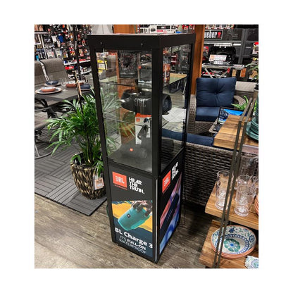 Black fixture with a display speaker from Emery Jensen, designed for secure mounting in commercial or retail settings.