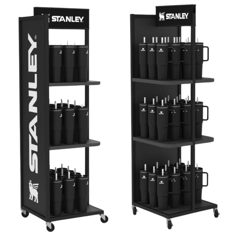 Black Stanley dispensing rack from Emery Jensen, used for organizing and holding fixtures in a workshop or industrial setting.