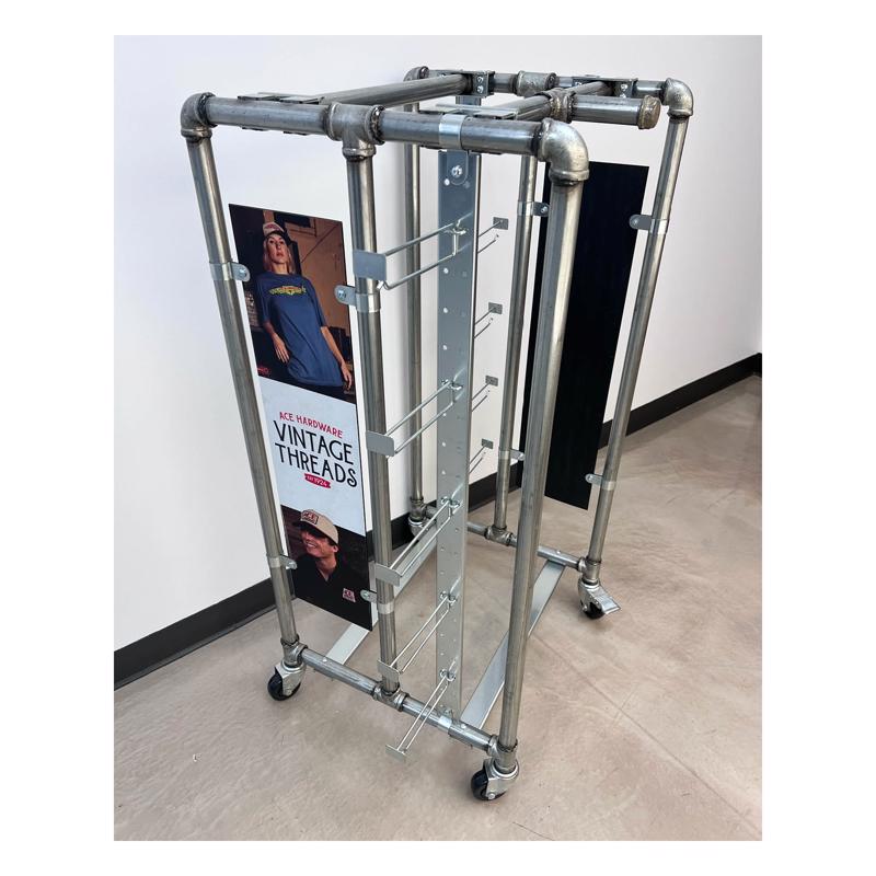 Vintage Emery Jensen 48-inch apparel rack fixture for displaying clothing in retail or storage spaces.