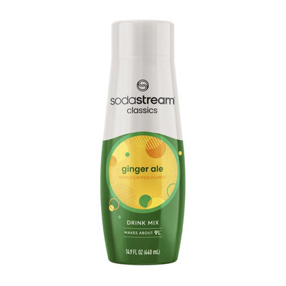 Emery Jensen SODAMIX Ginger Ale flavor mix in a clear bottle with a golden label, showcasing fresh ginger root and lime slices.