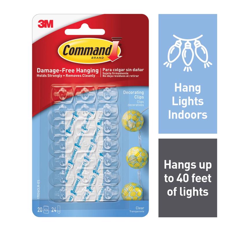 Emery Jensen Deco Clip CLR Command, clear general-purpose clip for organizing and securing items, shown in close-up.