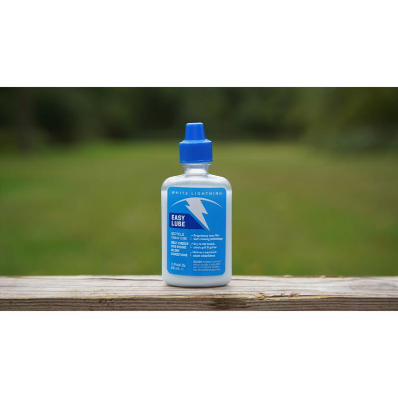 Emery Jensen Easy Lube Bike 2oz bottle for bicycle maintenance and general repair, featuring a clear label and applicator spout.