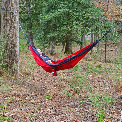 Red nylon hammock from Emery Jensen, 10-foot outdoor hammock with sturdy fabric and comfortable design.