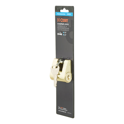 Brass 2-inch coupler lock for hitch ball towing by Emery Jensen, securing trailer connections and towing accessories.
