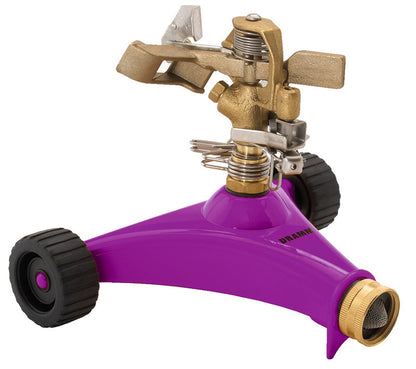Metal impulse sprinkler by Emery Jensen, showing the rotating head and metal construction for even watering of lawns.