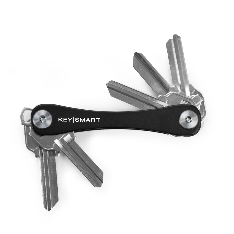 Emery Jensen KeySmart key holder in black, showcasing a compact key ring organizer with multiple keys attached.