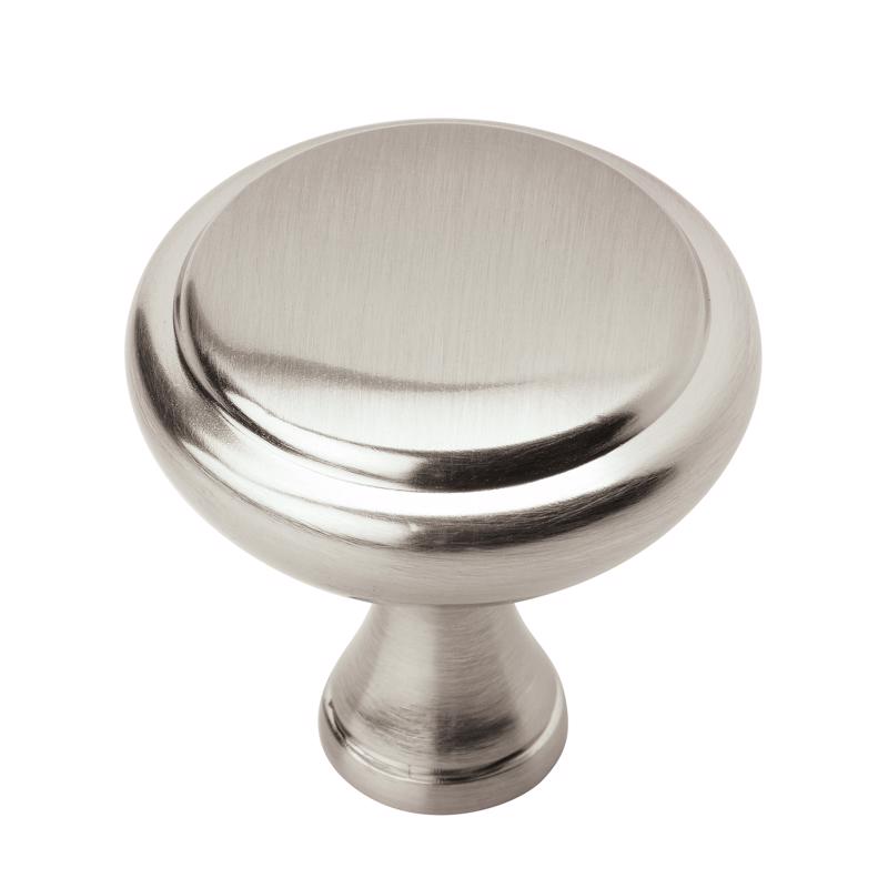 Six Emery Jensen cabinet knobs in a 1-1/4 inch size, featuring a simple round design for versatile furniture updates.