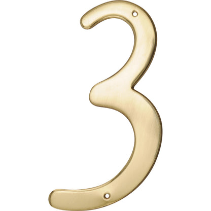 Set of three Emery Jensen 4-inch gold metal nail-on nails for construction or repair projects.