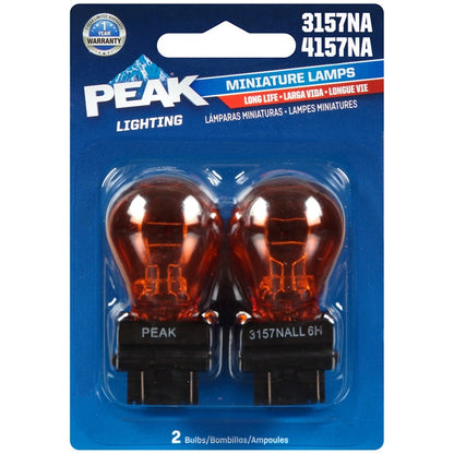 Emery Jensen Peak Minilamp 3157/4157NA miniature lamp showing clear glass and metal base for automotive lighting.