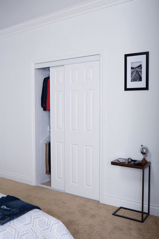 Emery Jensen mirrored bypass door in 60x80.5-inch size, featuring sleek reflective glass panels for modern closet or room entry.