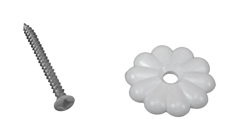 White plastic button rosette for mobile home parts by Emery Jensen, shown on a mobile home wall.